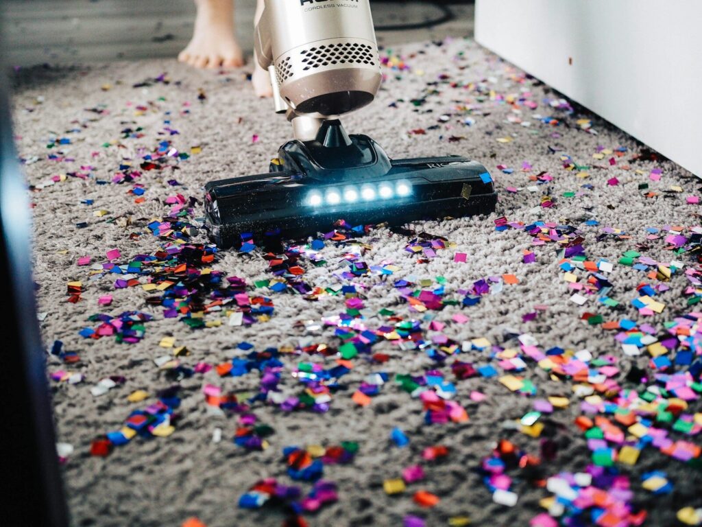Window squeegee removing embedded pet hair from carpet