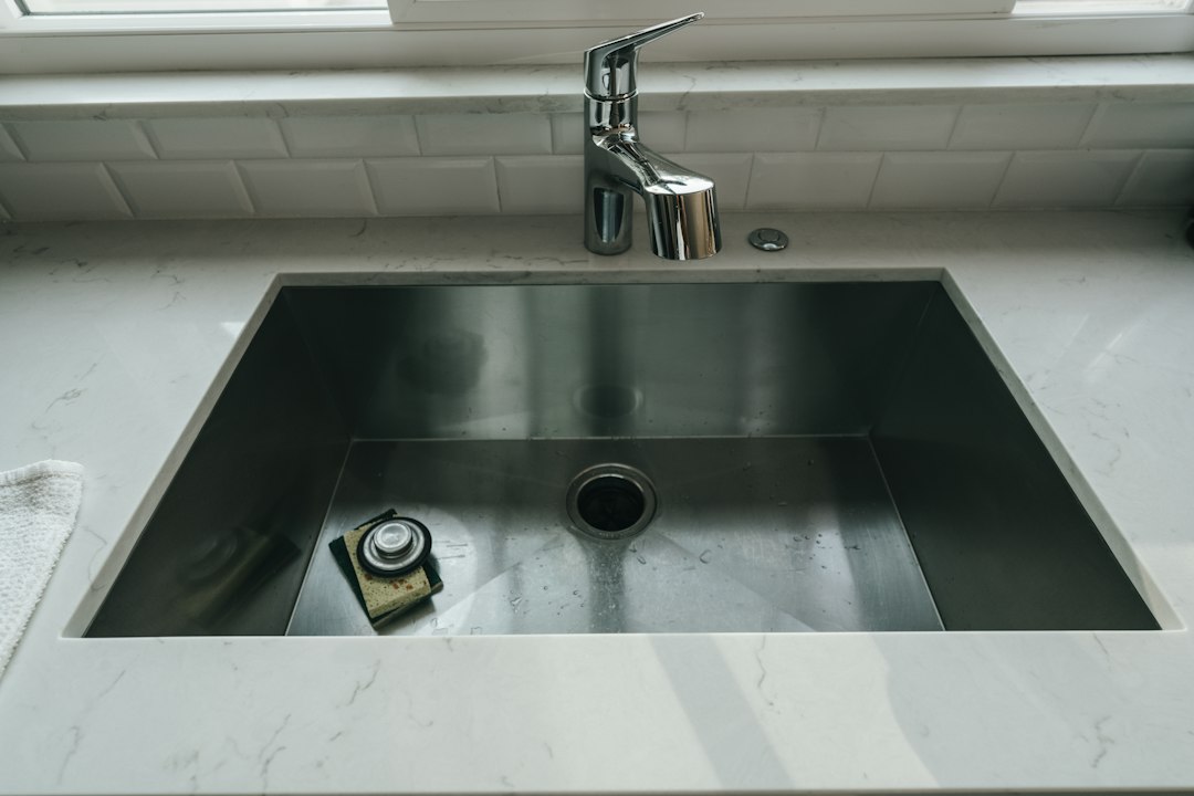 Stainless steel kitchen sink and faucet